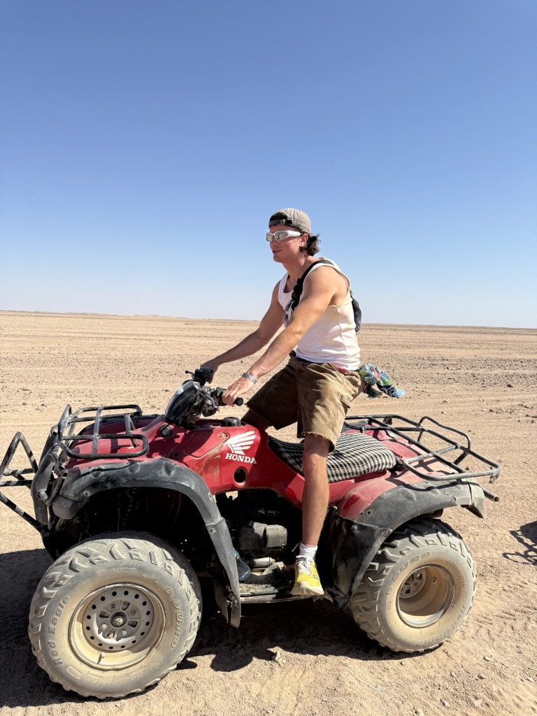 Ed on a quad bike in the desert