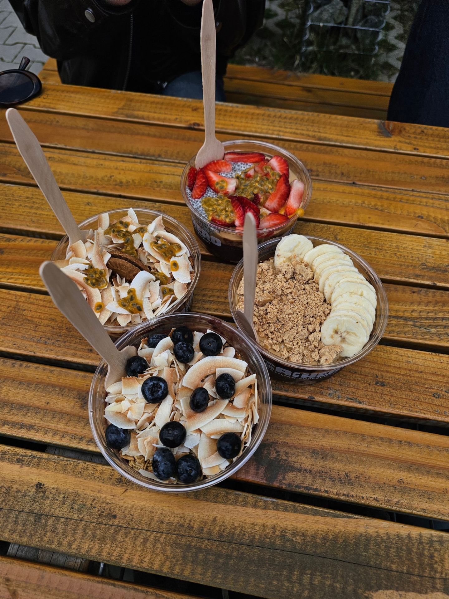 Fruit and acai bowls on a wooden table